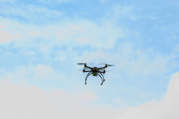 Naklejka na ściany i meble flying drone on the sky
