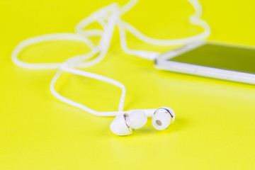 selective focus of white earphones for using with digital music