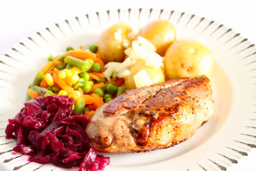 Duck breast dinner.
Duck breast dinner with vegetables and red cabbage.
