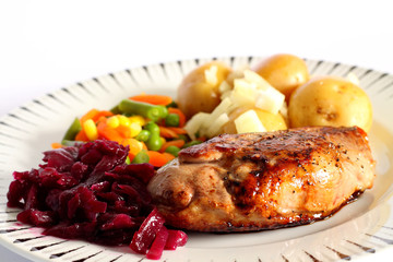 Duck breast dinner.
Duck breast dinner with vegetables and red cabbage.