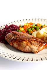 Duck breast dinner.
Duck breast dinner with vegetables and red cabbage.