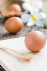 Break eggs on wood plate