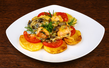 Roasted salmon with potato and tomato