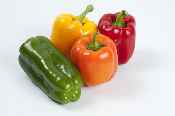 four fresh paprikas on white background	