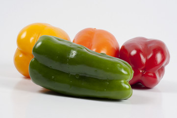 four fresh paprikas on white background	