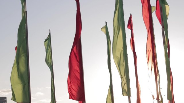 Belarusian flags flattering in the sky with the light of the sunset
