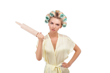 Beautiful young housewife is showing her irritation