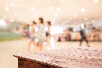 Shopping mall blurred background with wooden floor