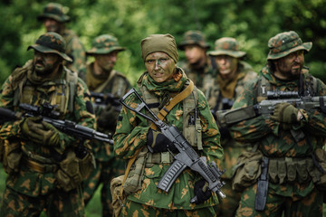 Group of soldiers special forces during the raid in the forest