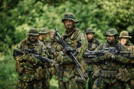 Group of soldiers special forces during the raid in the forest