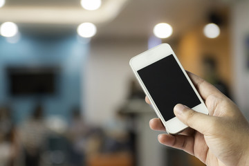 Hand with smartphone in class room, education concept