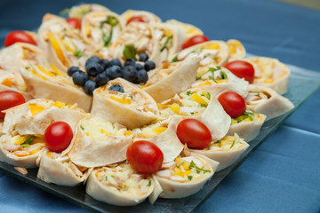 Turkey Wraps and raspberries, tomatoes, melons anb blueberries