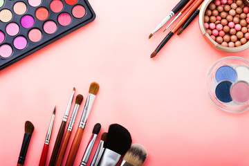 Cosmetics on pink background. Top view