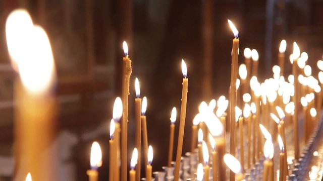 Wax candles burning in the Orthodox Church. There Is The Sound