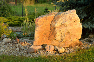 Huge stone and decorative garden pond