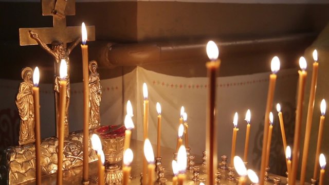 Wax Candles Burning In The Orthodox Church. There Is The Sound
