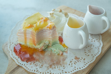 Rainbow Crepe Cake on the marble table 