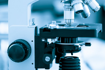 Binocular microscope on blue background