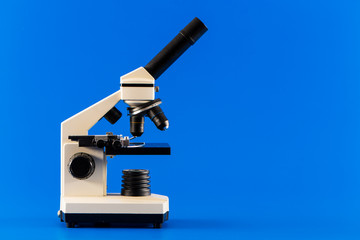 monocular microscope on blue background