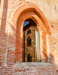 Fototapeta na wymiar Visconti-Sforza castle in Vigevano. Building reflected in a wind