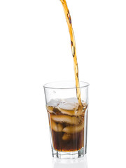 Cola poured into glass isolated on white background