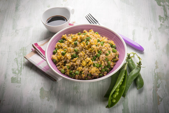 barley risotto with green peas scramble eggs and soy sauce