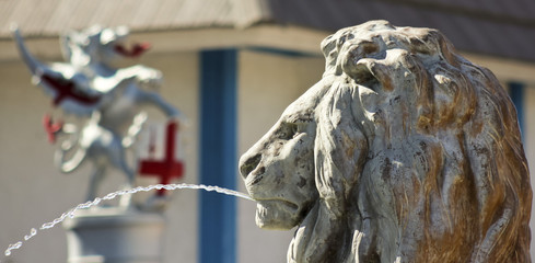A Lion Statue Shoots an Arc of Water