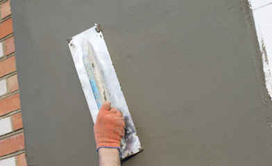 The process of applying putty with a spatula