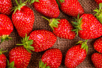 strawberries closeup on a linen towel, top view