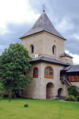 Fototapeta na wymiar Interior garden of an old monastery in Romanian Moldavian Mountains