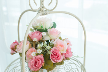 Artificial roses in the basket