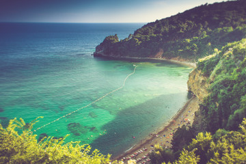 Fototapeta na wymiar Mogren beach near Budva in Montenegro at summertime.