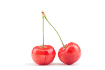 Two ripe cherry on a white background.
