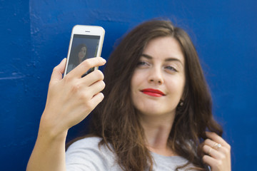 young beautiful woman using smart phone selfie