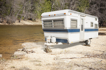 Classic Old Camper Trailer Near A River