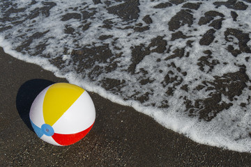 colorful ball on the seashore. Focus on ball