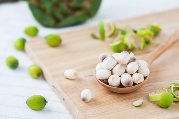 close up lotus seed on wooden spoon