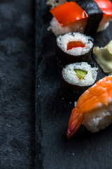 Sushi selection on black slate