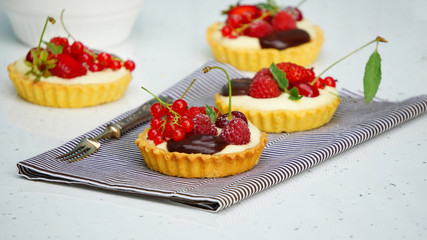 tartlets with custard and berries