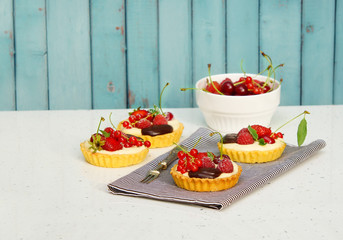 tartlets with custard and berries