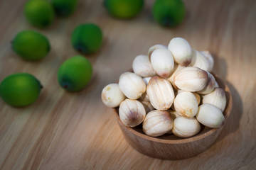 close up lotus seed on small wooden cup