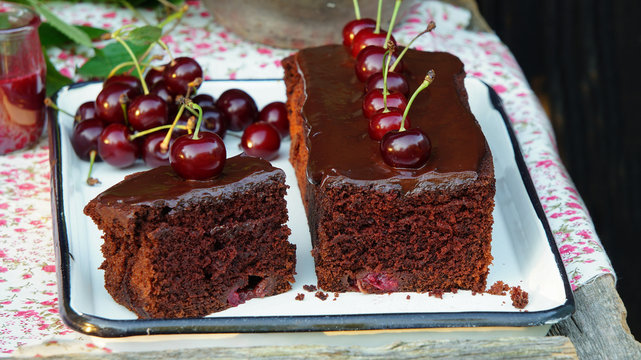 Chocolate cake with cherries and dark chocolate icing
