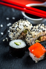 Sushi selection on black slate