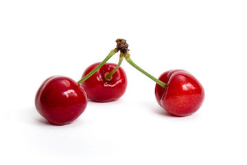 Three fresh cherries isolated on white background