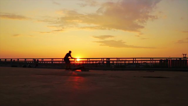 Roller make trick on sunset