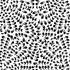 Seamless background made of exotic pattern in black and white co