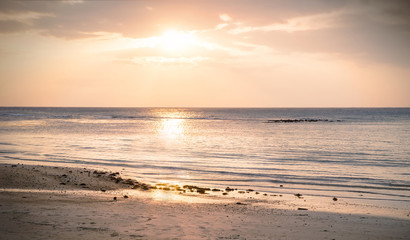 Beautiful view of sunset on the beach. © Acronym