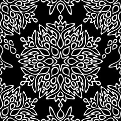 Seamless background made of exotic pattern in black and white co