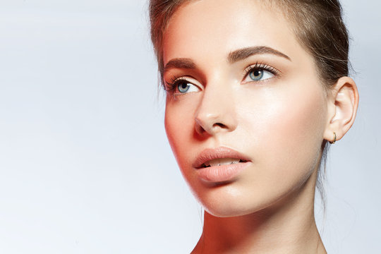 Close-up Portrait Of A Woman With Perfect Skin Clean In The Light Of The Red Light