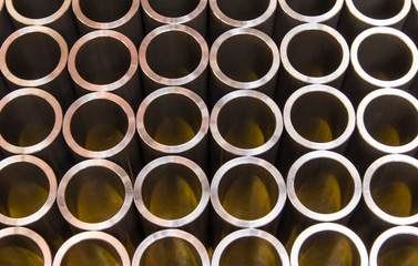 Stack of steel pipes automotive parts production industry